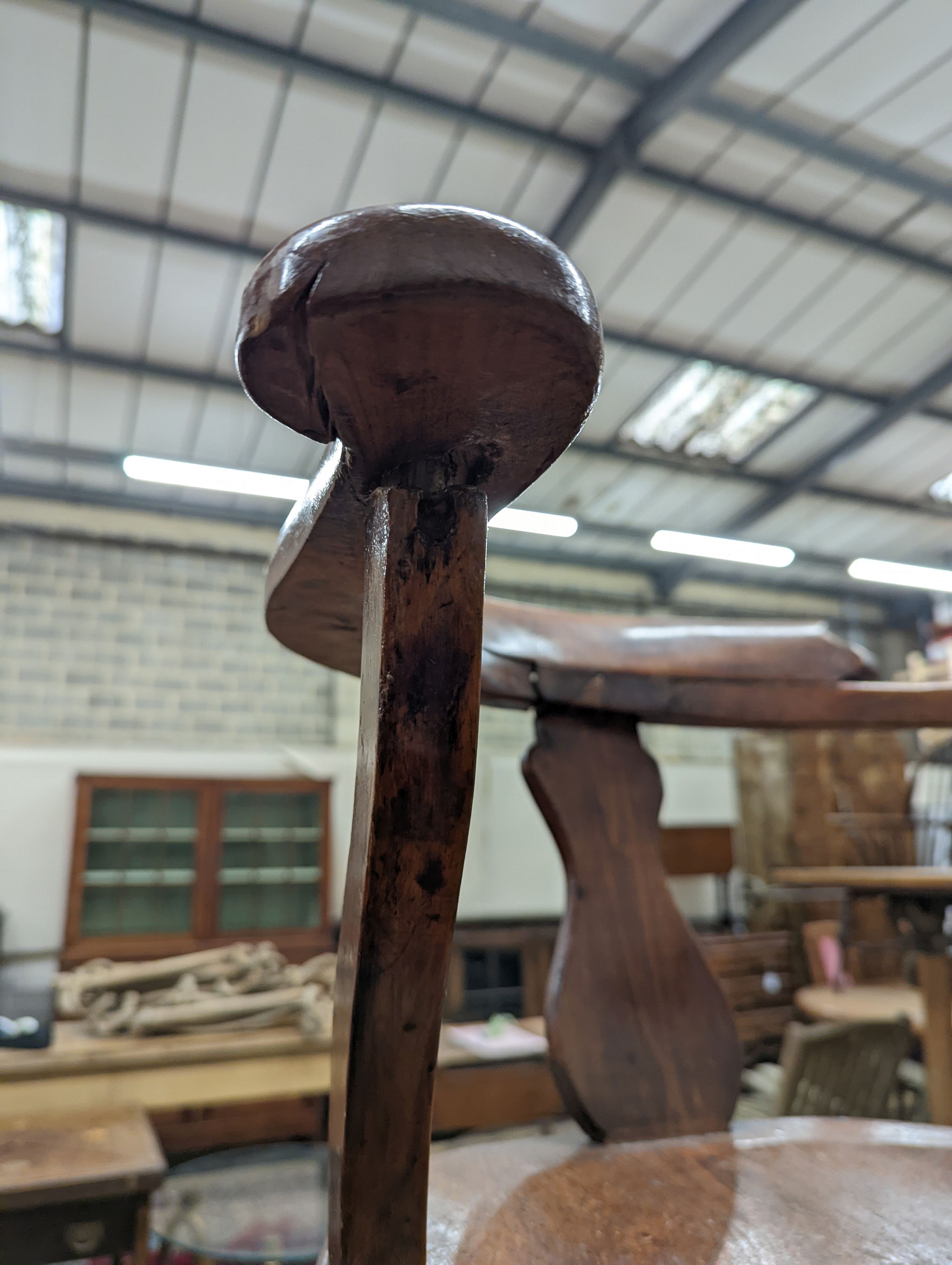 Two early 20th century swivel desk chairs and another chair.